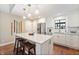 Spacious kitchen featuring a large island with granite countertop, stainless appliances, and a breakfast bar at 35 Osage Ct, Columbus, IN 47201