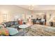Open-concept living room with hardwood floors, comfortable seating, and seamless flow to the kitchen at 35 Osage Ct, Columbus, IN 47201