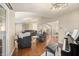 Bright, spacious living room with hardwood floors, an open concept, and a charming piano at 35 Osage Ct, Columbus, IN 47201