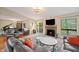 Spacious living room featuring a fireplace, a piano, and sliding glass doors to the outdoor area at 35 Osage Ct, Columbus, IN 47201