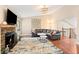 Bright living room featuring a cozy fireplace, hardwood floors, and stylish decor at 35 Osage Ct, Columbus, IN 47201