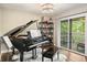 Elegant living room showcasing a grand piano and stylish shelving, offering a refined and sophisticated ambiance at 35 Osage Ct, Columbus, IN 47201