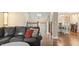 Living room featuring hardwood floors, a staircase, an open layout, and access to the dining area at 35 Osage Ct, Columbus, IN 47201