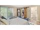 Bright main bedroom with patio access, barn door closet and convenient en-suite bathroom at 35 Osage Ct, Columbus, IN 47201