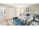 Spacious main bedroom with a comfortable king bed, sitting area, and modern decor at 35 Osage Ct, Columbus, IN 47201