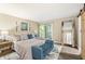 Comfortable main bedroom with walk-out balcony, full length mirror, and lots of natural light at 35 Osage Ct, Columbus, IN 47201