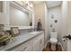 Well-lit powder room with modern vanity, stylish mirror, and neutral decor at 35 Osage Ct, Columbus, IN 47201