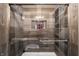 Walk-in shower with custom tile work, shampoo niche, and glass door with metal trim at 35 Osage Ct, Columbus, IN 47201