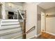Open staircase with modern railings leads into the main living space of this home at 35 Osage Ct, Columbus, IN 47201