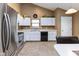 Bright kitchen featuring white cabinets, stainless steel appliances, and efficient layout at 3630 Foxtail Dr, Indianapolis, IN 46235