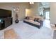 Comfortable living room showcasing neutral tones, a media center, and an open floor plan at 3630 Foxtail Dr, Indianapolis, IN 46235