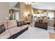 Spacious living room with neutral carpeting, comfortable seating, and open access to the kitchen at 3630 Foxtail Dr, Indianapolis, IN 46235