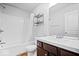 Bright bathroom featuring a shower-tub combination, vanity, and elegant fixtures and hardware at 3658 Graceland Ave, Indianapolis, IN 46208