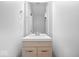 Modern bathroom with a sleek vanity, mirror, and contemporary fixtures at 3658 Graceland Ave, Indianapolis, IN 46208