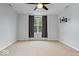 The spacious bedroom offers carpet floors, natural light from the windows, and neutral decor at 3658 Graceland Ave, Indianapolis, IN 46208