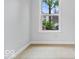 Empty bedroom with carpet floors offers natural light from the window at 3658 Graceland Ave, Indianapolis, IN 46208