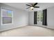 Spacious bedroom with carpet floors, natural light from the windows, and neutral decor at 3658 Graceland Ave, Indianapolis, IN 46208