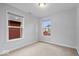 Empty bedroom with carpet floors offers natural light from the windows at 3658 Graceland Ave, Indianapolis, IN 46208