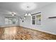 Open-concept dining area with modern lighting and hardwood floors, perfect for hosting dinners and gatherings at 3658 Graceland Ave, Indianapolis, IN 46208
