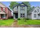 Charming two-story home with blue trim and a well-manicured lawn, perfect for a Gathering at 3658 Graceland Ave, Indianapolis, IN 46208