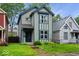 Charming two-story home with blue trim and a well-manicured lawn, perfect for a Gathering at 3658 Graceland Ave, Indianapolis, IN 46208