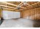 Spacious garage interior with a ceiling fan and an insulated garage door at 3658 Graceland Ave, Indianapolis, IN 46208