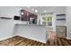 Kitchen features a breakfast bar with granite countertops, stainless appliances, and updated cabinetry at 3658 Graceland Ave, Indianapolis, IN 46208