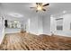 Open-concept living room and kitchen with hardwood floors, perfect for modern living and entertaining guests at 3658 Graceland Ave, Indianapolis, IN 46208