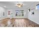 Bright and airy living room with wood floors and a large window, ideal for entertaining or relaxing at 3658 Graceland Ave, Indianapolis, IN 46208