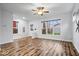 Bright and airy living room with wood floors and a large window, ideal for entertaining or relaxing at 3658 Graceland Ave, Indianapolis, IN 46208