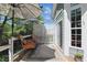 Private outdoor deck with patio furniture, sun umbrella, and a view of the lush surrounding greenery at 3815 Harrison Crossing Ln, Greenwood, IN 46142