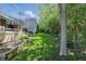 Spacious backyard featuring a lush lawn and mature trees, perfect for outdoor activities and enjoying nature at 3815 Harrison Crossing Ln, Greenwood, IN 46142