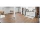 Basement featuring wood floors, and an entertainment and kitchenette area at 3815 Harrison Crossing Ln, Greenwood, IN 46142