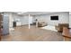 Spacious finished basement with wood floors, entertainment area, and kitchenette at 3815 Harrison Crossing Ln, Greenwood, IN 46142