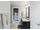 Bathroom view showing vanity with granite countertop, connecting to an adjacent bedroom at 3815 Harrison Crossing Ln, Greenwood, IN 46142