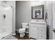Modern bathroom with a glass door shower, and vanity with plenty of storage at 3815 Harrison Crossing Ln, Greenwood, IN 46142