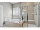 Bright bathroom showcasing a tiled tub, and shower with a glass door and bench at 3815 Harrison Crossing Ln, Greenwood, IN 46142
