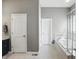 Bright, gray bathroom with tub and walk through doors at 3815 Harrison Crossing Ln, Greenwood, IN 46142