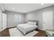 Well-lit bedroom featuring hardwood floors, neutral paint, a patterned rug, and a Queen size bed at 3815 Harrison Crossing Ln, Greenwood, IN 46142