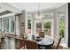 Bright dining area with a chandelier and a sliding glass door to the outdoor patio at 3815 Harrison Crossing Ln, Greenwood, IN 46142