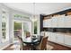 Cozy dining area featuring a chandelier and sliding door leading to outdoor seating at 3815 Harrison Crossing Ln, Greenwood, IN 46142
