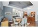 Dining area with hardwood floors and stylish light fixture at 3815 Harrison Crossing Ln, Greenwood, IN 46142