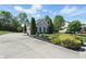 Charming single-story home with a long driveway, manicured landscaping, and a spacious three-car garage at 3815 Harrison Crossing Ln, Greenwood, IN 46142