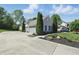 Well maintained home with a concrete driveway, side entry garage, and mature landscaping and manicured lawn at 3815 Harrison Crossing Ln, Greenwood, IN 46142