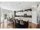 Modern kitchen with granite countertops, stainless steel appliances, and a center island at 3815 Harrison Crossing Ln, Greenwood, IN 46142