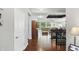Open-concept design with hardwood flooring that flows into the living room with large windows offering backyard views at 3815 Harrison Crossing Ln, Greenwood, IN 46142