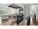 Bright open-concept living and dining area with hardwood floors and abundant natural light at 3815 Harrison Crossing Ln, Greenwood, IN 46142