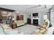 Inviting living room with cozy fireplace, hardwood floors and an open floorplan at 3815 Harrison Crossing Ln, Greenwood, IN 46142