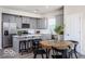 Modern kitchen with gray cabinets, stainless steel appliances, and an island at 3899 Sterling Dr, Whitestown, IN 46075