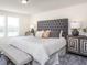 Bedroom featuring neutral tones, upholstered headboard, and matching side tables at 3899 Sterling Dr, Whitestown, IN 46075